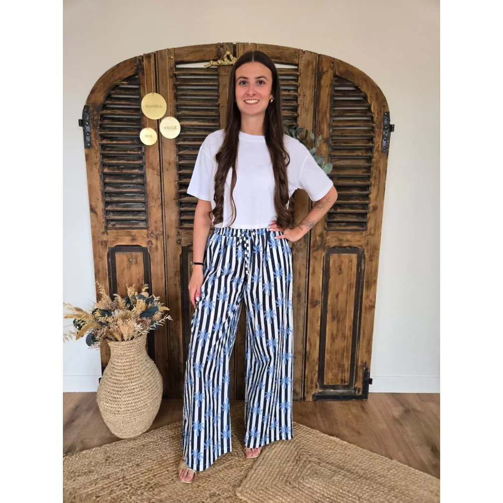 Pantalon fluide en coton bleu rayé et palmiers