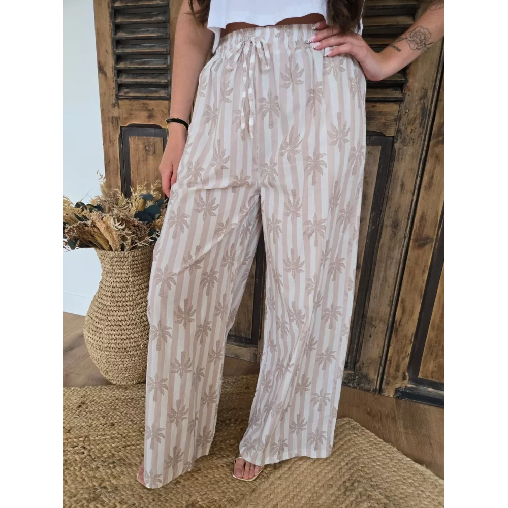 Pantalon fluide en coton beige rayé et palmiers