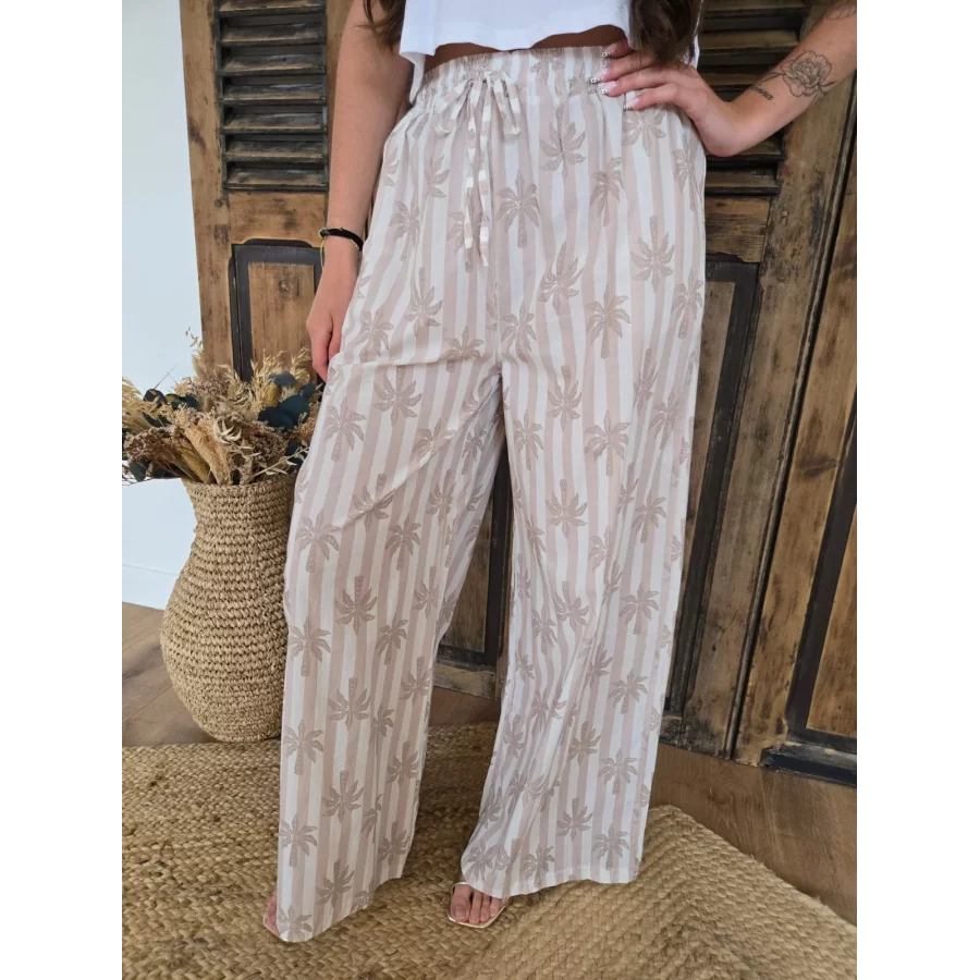 Pantalon fluide en coton beige rayé et palmiers