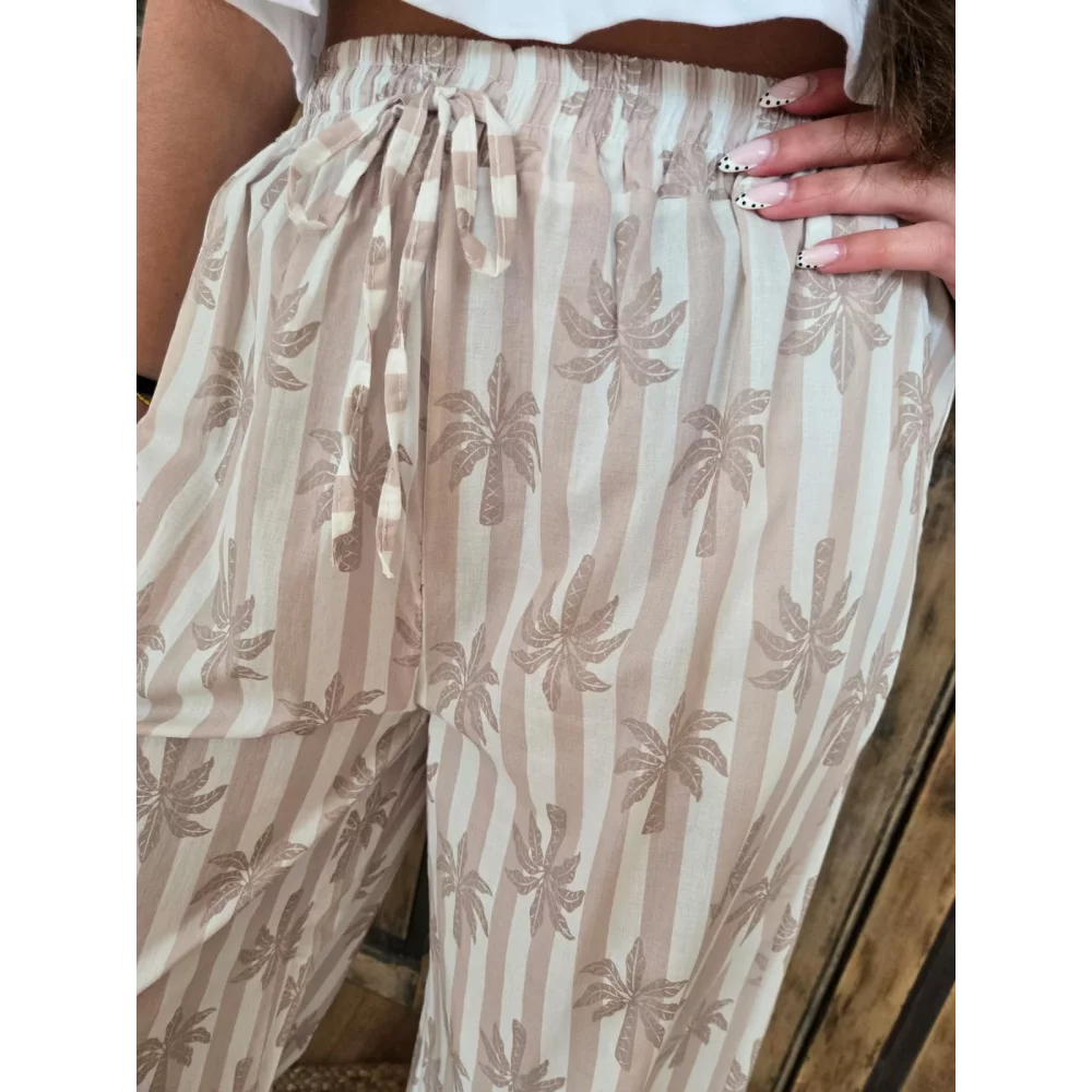 Pantalon fluide en coton beige rayé et palmiers